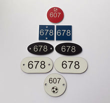 1.5mm or 3mm thick durable stadium seat numbers - plastic seat indicators - plastic numbered discs for stadium seats - laminate seat numbers